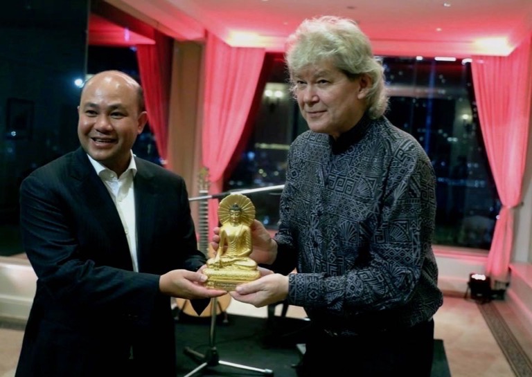 Receiving a gift from His Excellency Mr. Hun Mani, Member of Parliament and President of the Union of Youth Federations of Cambodia